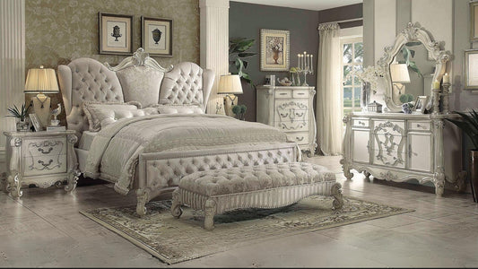 Elegant bedroom with ornate furniture and decorative elements.