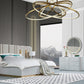 Modern bedroom with a large bed, nightstands, and a dresser.