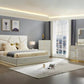 Modern bedroom with a large bed, nightstands, and dresser.