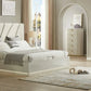 Neatly arranged bedroom with a bed, nightstands, and dresser.