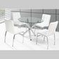 Round glass dining table with four white chairs in a modern setting.
