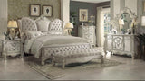 Elegant bedroom with ornate furniture and decorative elements.
