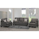 Gray sofa set with patterned cushions in a living room setting.