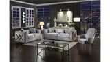 Modern living room with gray sofa, armchair, and coffee table in a stylish interior setting.