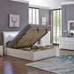 Modern bedroom with a lift-top bed, dresser, and nightstands.