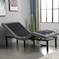 Gray adjustable bed in a room with a window and decor