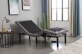 Gray adjustable bed in a room with a window and decor